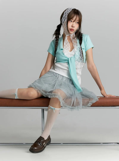 LEWKIN Tulle Frill Hem Midi Skirt CL514 Light blue S/M full-length front shot on model seated on bench, sheer layered tulle with ruffle hem, styled with loafers