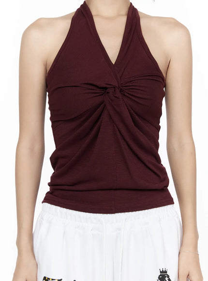 Twist Halter Top CL524 Dark red close-up front crop view on model highlighting center twist knot detail V-neckline halter straps and draped soft jersey fabric