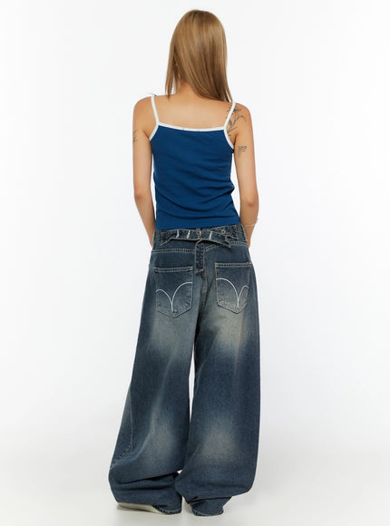 Two-Tone Cami Top IL524 Blue back model shot full-body showing white contrast spaghetti straps and smooth ribbed back panel styled with wide-leg baggy jeans