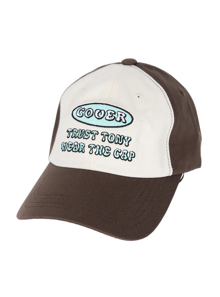Two-Tone Graphic Cap IL515 Dark brown angled flat shot, three-quarter view of brown and cream cap showing COOER teal embroidery and structured cotton brim