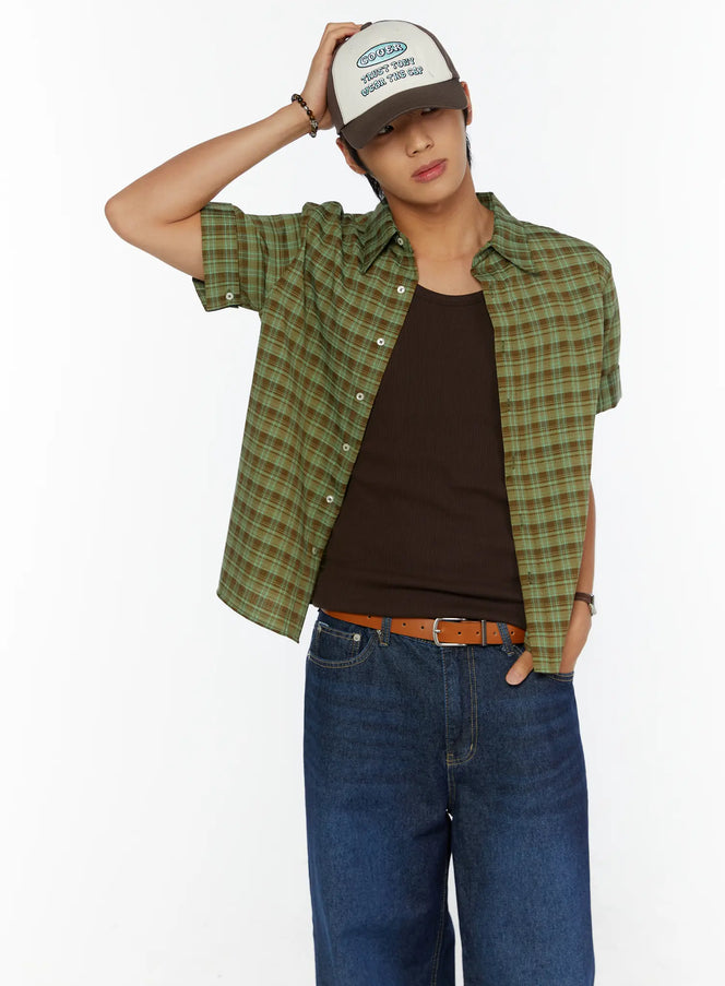 LEWKIN Two-Tone Graphic Cap IL515 Dark brown front model shot, male model wearing cap hand raised to brim, styled with green plaid shirt and blue jeans