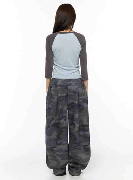 Two-Tone Long Sleeve Top IL523 Light blue back shot on model showing light blue back panel and charcoal raglan sleeves with oversized camo wide-leg pants