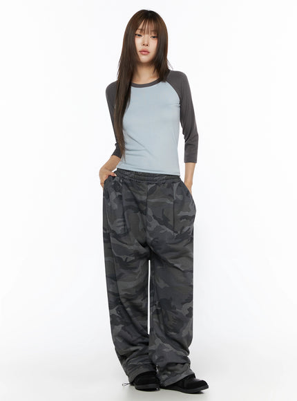 Two-Tone Long Sleeve Top IL523 Light blue full-body front shot on model standing straight with hands in pockets, styled with dark camo wide-leg pants