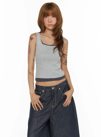 Two-Tone Tank Top CL503 Gray front shot on model hands in pockets showing fitted crop silhouette with dark contrast trim at neck and hem