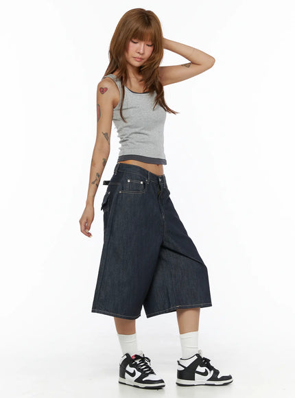 Two-Tone Tank Top CL503 Gray side shot on model with hand raised behind head showing ribbed texture and dark contrast hem trim