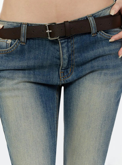 LEWKIN Unisex Square Belt IU524 Brown close-up detail on model showing silver square buckle and punch holes threaded through low-rise washed denim jeans