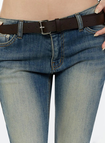 LEWKIN Unisex Square Belt IU524 Brown close-up detail on model showing silver square buckle and punch holes threaded through low-rise washed denim jeans