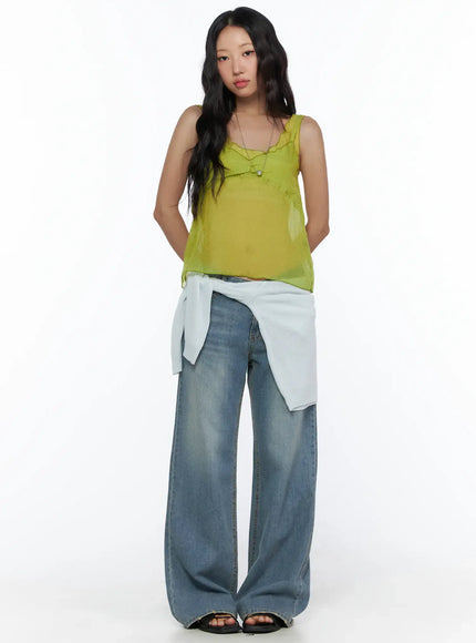 V-Neck Layered Sleeveless Blouse CL510 Green full-body front shot on model standing hands behind back styled with wide-leg jeans and sandals sheer layered fabric