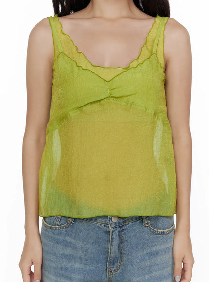 V-Neck Layered Sleeveless Blouse CL510 Green close-up front shot on model cropped at chest highlighting scalloped V-neckline and sheer layered chiffon with lace trim