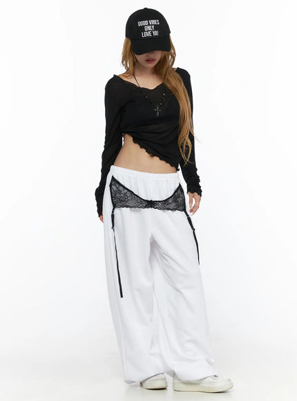 V-Neck Lettuce Trim Sheer Long Sleeve Top CL528 Black full-body front shot on model wearing cap lettuce hem crop top with white wide-leg pants