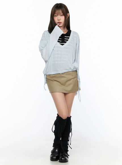 V-Neck Loose Drawstring Long Sleeve Top CL514 light blue front view on model standing with black striped inner top layered underneath paired with black knee boots