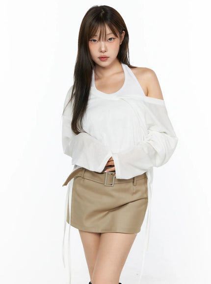 V-Neck Loose Drawstring Long Sleeve Top CL514 white front view on model wearing off-shoulder style with khaki belted mini skirt standing pose