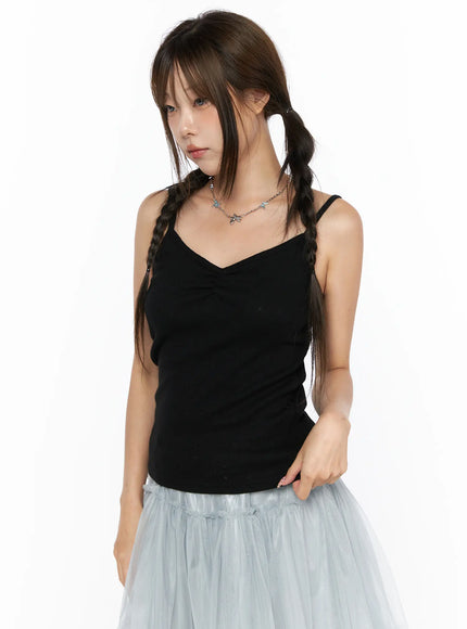 V-Neck Pointelle Cami Top CL514 Black close-up front view on model with V-neckline ruched detail styled with blue tulle skirt and chain necklace