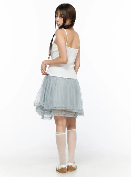 V-Neck Pointelle Cami Top CL514 White back view on model size S/M revealing open back spaghetti straps with voluminous blue tulle skirt and white knee socks