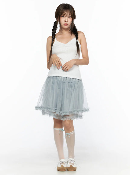 V-Neck Pointelle Cami Top CL514 White full-body front view on model size S/M hands clasped at waist styled with blue ruffle tulle skirt and white knee socks
