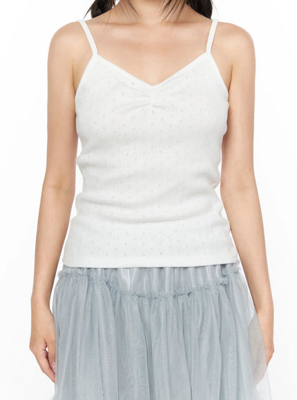 V-Neck Pointelle Cami Top CL514 White close-up front detail shot on model showing pointelle knit texture V-neckline ruching and thin spaghetti straps