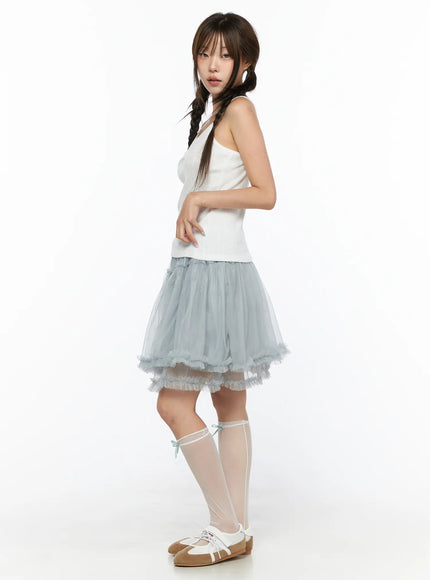 V-Neck Pointelle Cami Top CL514 White side view on model size S/M showing slim silhouette and spaghetti straps with layered blue tulle skirt