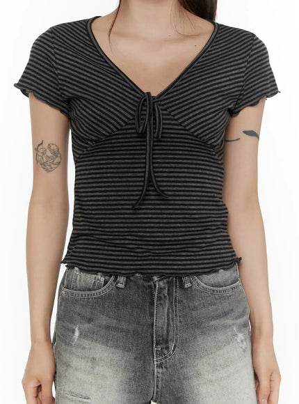 V-Neck Ribbon Striped Short Sleeve Tee CL507 Black close-up front model shot size S/M highlighting V-neck ribbon bow ruched bust and frill sleeve edges