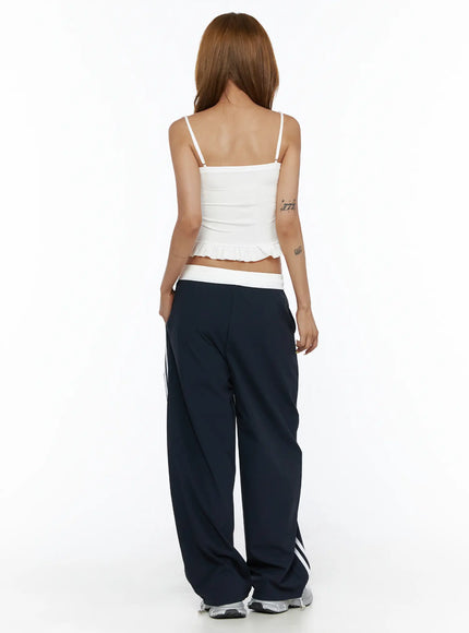 V-Neck Ruffle Cami Top CL503 White back shot on model, straight back neckline with thin adjustable spaghetti straps and ruffle hem detail