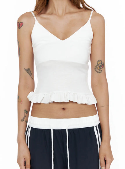 V-Neck Ruffle Cami Top CL503 White close-up front shot on model torso, V-neck neckline and pleated ruffle hem detail clearly visible