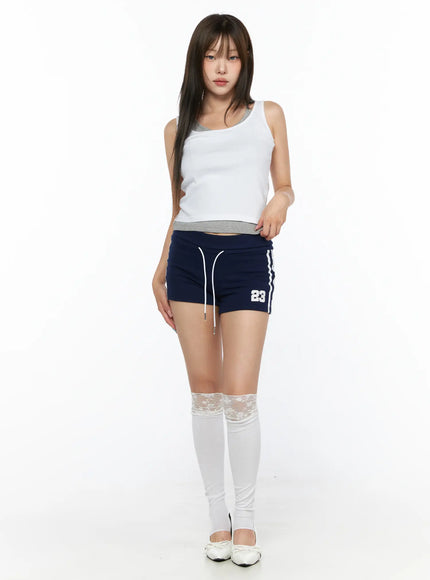 Varsity Athletic Shorts CL514 Dark blue front full-body shot on model standing straight styled with white tank top and lace knee-high socks