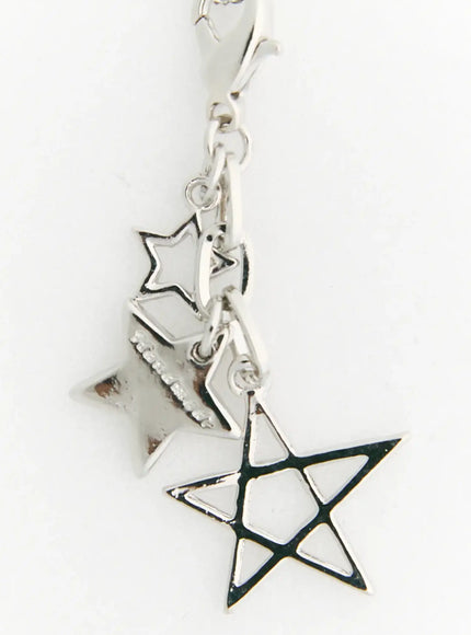 Vega Star Layer Necklace IL517 Silver close-up detail of multi-star charms with open-cut geometric star and lobster clasp connector