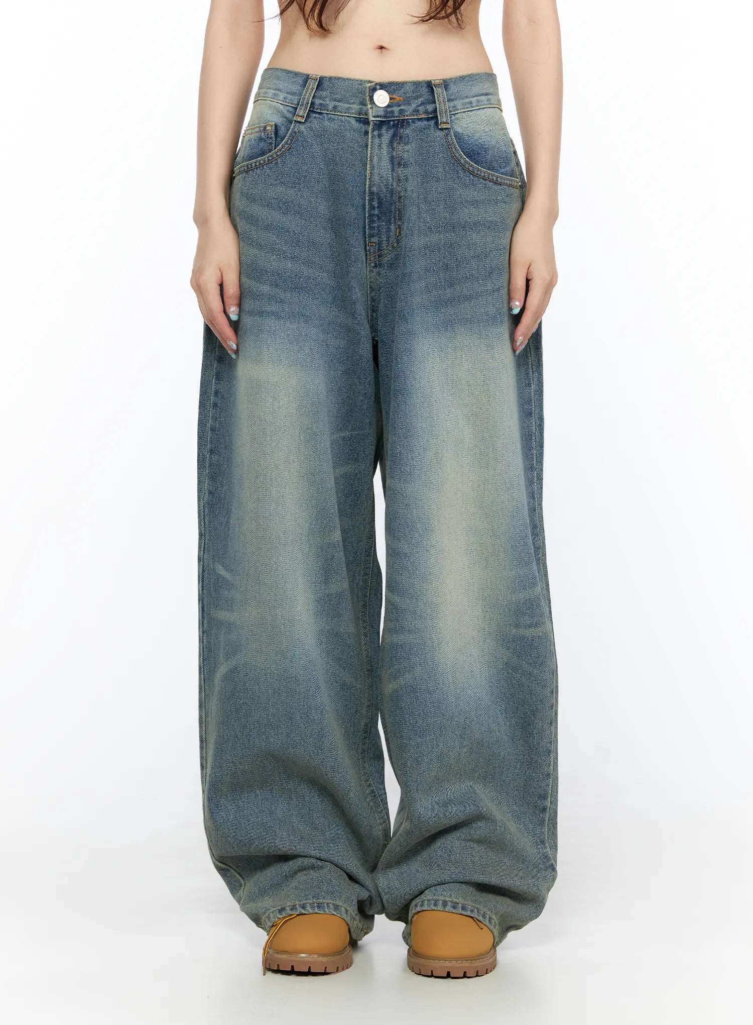 LEWKIN Vexi Washed Baggy Jeans CL523 Blue front close-up on model showing low-rise waistband, button closure, front pockets, and faded wash denim texture, Size S