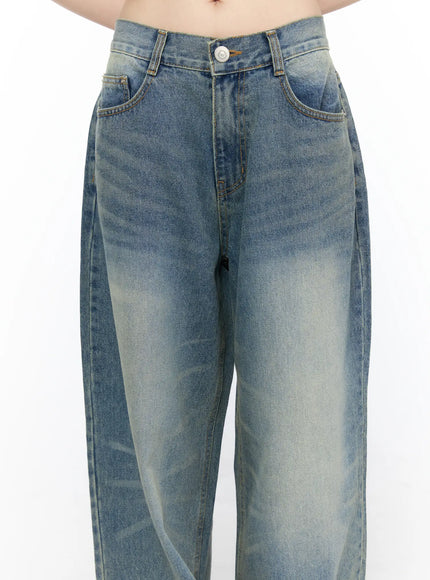 Vexi Washed Baggy Jeans CL523 Blue close-up detail of front waistband, button closure, belt loops, and front pockets highlighting gradient sun-faded denim wash