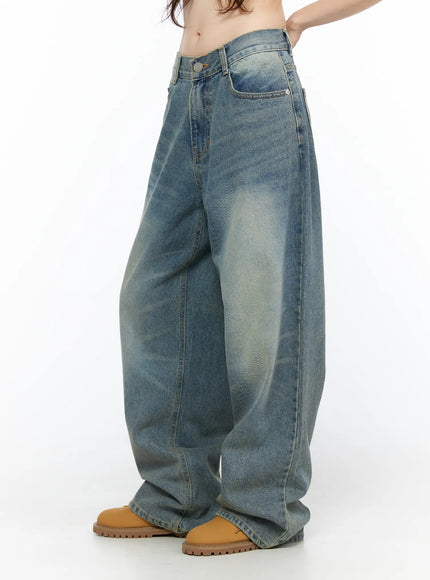 Vexi Washed Baggy Jeans CL523 Blue side close-up on model showing low-rise waistband detail, side seam, and voluminous wide-leg silhouette with sun-faded wash