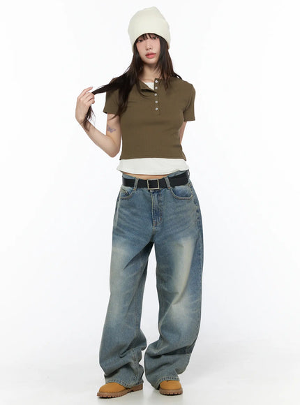 Vexi Washed Baggy Jeans CL523 Blue full-body front shot on model in white beanie and olive crop top, standing with hand in hair showing complete baggy fit