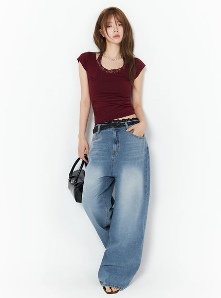 Veya Washed Baggy Jeans IU525 Blue full-length front shot on model styled with burgundy lace crop top, pearl necklace, black braided belt, and black bag