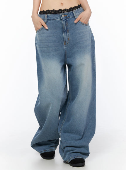 Veya Washed Baggy Jeans IU525 Blue front waist-to-hem shot on model, hands in pockets, low-rise wide-leg washed denim with faded wash and black lace trim