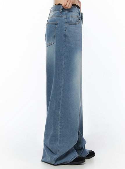 Veya Washed Baggy Jeans IU525 Blue side close-up shot on model showing side seam, back pocket placement, and voluminous wide-leg silhouette with faded wash