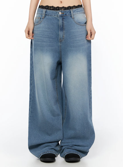 LEWKIN Veya Washed Baggy Jeans IU525 Blue front crop shot on model size S, low-rise waistband with black lace trim detail, wide-leg washed denim
