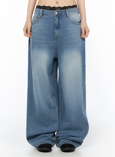 LEWKIN Veya Washed Baggy Jeans IU525 Blue front crop shot on model size S, low-rise waistband with black lace trim detail, wide-leg washed denim