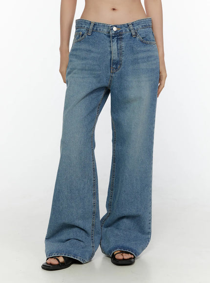 Vienne Wide Leg Jeans CL521 Blue front view on model Size S, low-rise wide-leg jeans with button closure and subtle faded wash, black sandals