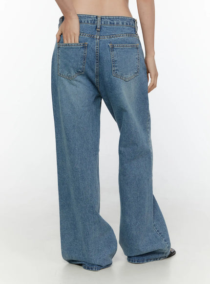 Vienne Wide Leg Jeans CL521 Blue back three-quarter view on model hand in pocket, showing full wide leg silhouette and back pockets