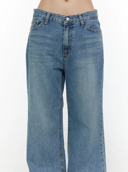 Vienne Wide Leg Jeans CL521 Blue close-up front detail shot on model showing low-rise waist, button closure, front pockets with gold rivets