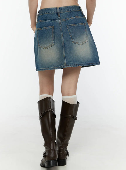 Vintage A-Line Denim Mini Skirt IL506 Blue back close-up on model showing two back patch pockets with contrast topstitching and vintage sun-faded wash effect