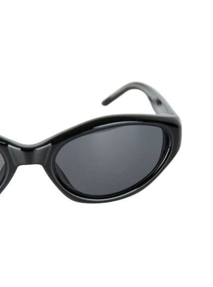 Vintage Cat Eye Fashion Sunglasses CL527 Black One Size close-up detail of glossy black oval lens with thick sculptural frame rim and partial temple arm