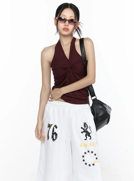 Vintage Cat Eye Fashion Sunglasses CL527 Beige One Size front model full-body shot styled with burgundy halter top and white graphic wide-leg pants with shoulder bag