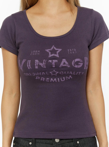Vintage Graphic U-Neck Tee IL524 Purple close-up front detail shot on model showing distressed VINTAGE star graphic print and scoop neckline ribbed cotton