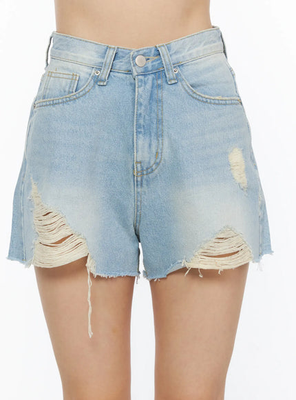Vintage Wash Denim Shorts CL501 Light blue close-up front shot on model highlighting heavy distressed rips raw frayed hem and high-rise waist