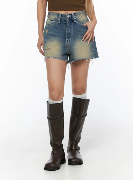 Vintage Wash Jorts CU523 Blue front mid-shot on model showing high-rise waistband frayed hem ripped distressing and yellow faded wash detail