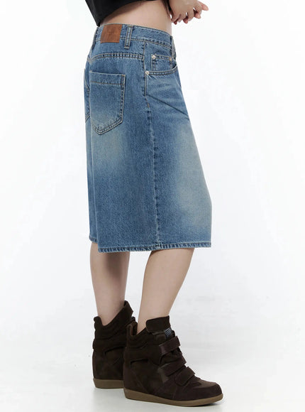 Vintage Wash Jorts IL502 Blue back close-up on model, featuring dual back pockets with V-stitch detail, leather THREE QUARTER patch, and faded wash
