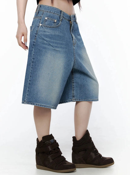 Vintage Wash Jorts IL502 Blue side view on model, showing wide-leg cut, front coin pocket, zip fly, and faded wash denim texture