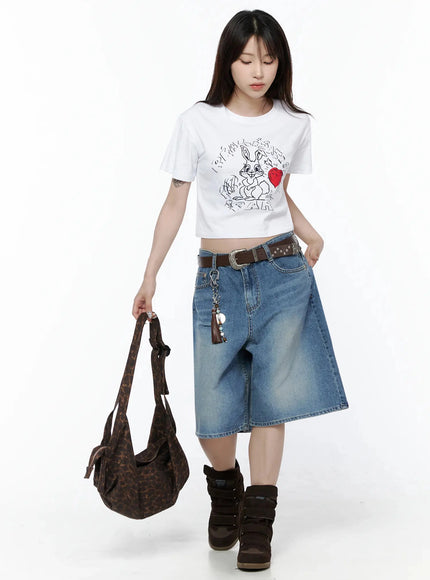 Vintage Wash Jorts IL502 Blue styled full-length model shot, looking down, belted with tassel chain, carrying leopard bag, wide-leg silhouette