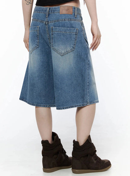 Vintage Wash Jorts IL502 Blue styled full-length model shot, looking down, belted with tassel chain, carrying leopard tote, white graphic tee