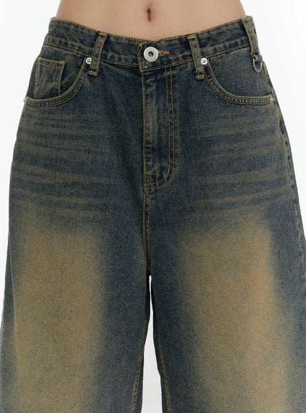 Vintage Washed Jorts CL508 Dark blue close-up front waistband detail showing button closure, front pockets and yellow topstitching on model
