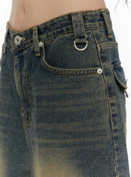 Vintage Washed Jorts CL508 Dark blue close-up side detail on model showing D-ring hardware, rivet accents and vintage sand-wash denim texture